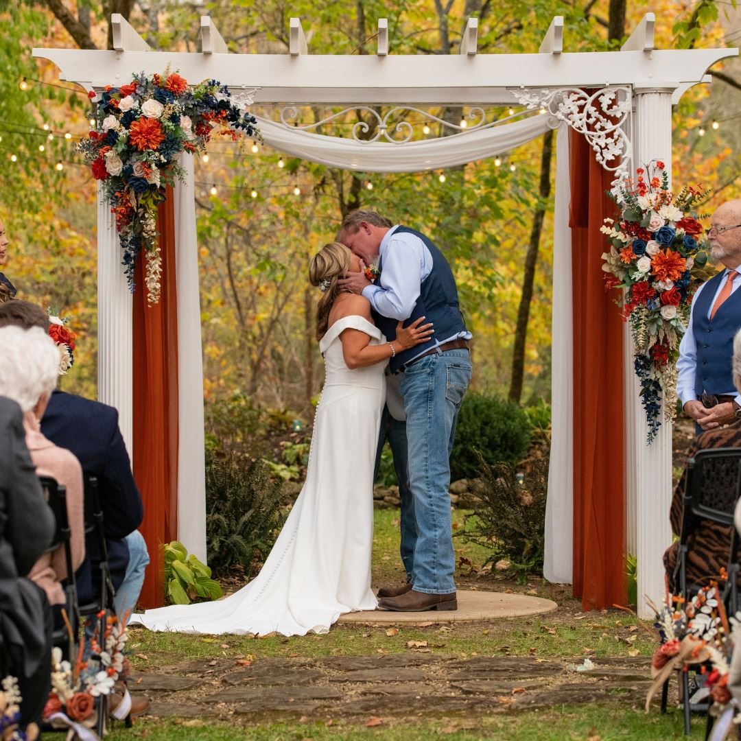 bride and groom's first kiss outdoor wedding